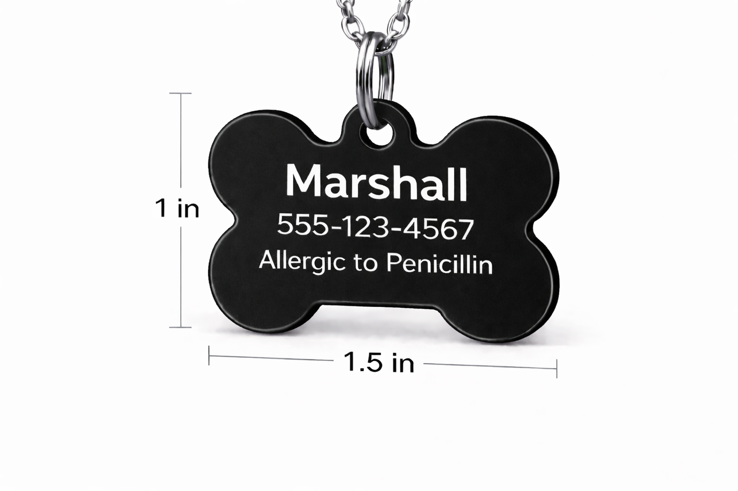 Black bone-shaped pet tag with engraved text on a white background